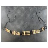Wood, bone and steel beaded choker with leather co