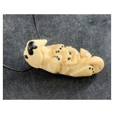 JSB adorable ivory otter with crab pendant on a le