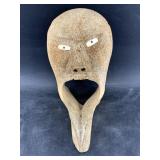 Fabulous mask made from a whalebone vertebrae with