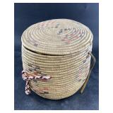 Hooper Bay lidded grass basket with a yarn handle,