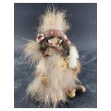 Tiny Native Alaskan doll with ivory face, grass Al