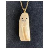 Abstract walrus pendant carved from walrus tooth