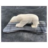 Walrus ivory carving of a polar bear set on a poli