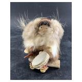Tiny Native Alaskan doll with ivory face, grass wi