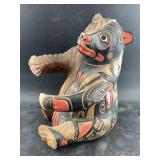 Wood carved bear wine bottle holder with Tlingit s