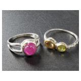 Pair of sterling silver rings, with rubies size 5,