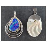 Pair of sterling silver pendants, total weight  12