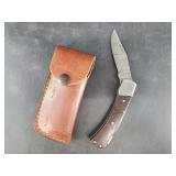 Folding knife with Damascus blade, 7" long when op