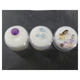 Several cannisters of cut and polished gemstones