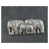 Sterling silver brooch depicting an elephant's fam