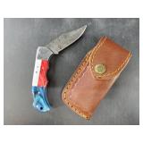 Folding pocket knife with Damascus blade and leath