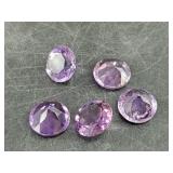 Loose amethyst gemstones faceted and polished, abo