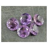 Loose amethyst gemstones faceted and polished, abo