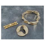 Several pieces of gold-tone fashion jewelry