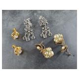 Several pairs of screw back earrings