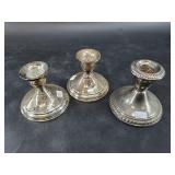 3 Weighted sterling silver candlesticks