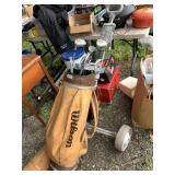 Wilson Golf cart with clubs and acessories.