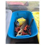 Plastic tote with various tools including hand saw