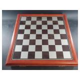 Chessboard with figurines in a compartment