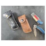 2 Damascus bladed folding knives with leather shea