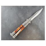 Butterfly knife with Bakelite scales and pocket cl