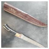 Damascus bladed knife with multi-colored handle an
