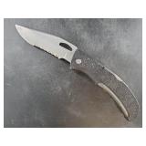 Vintage Gerber model 450 folding knife showing hon