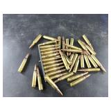 About 30 rounds of 5.56 including 10 rounds in a s
