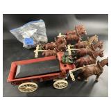 Lot with several cast iron toys, horse drawn wagon