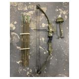 Vintage compound bow with quiver and extra arrows,