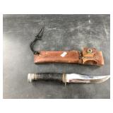 Ka-bar skinning knife with leather sheath, overall