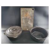 2 Cast iron pots: 1 with lid, other is a griddle
