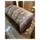 Antique steamer trunk with raised embossed top and
