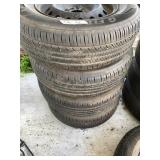 Set of 4 tires on rims, excellent tread, see photo