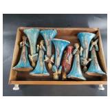 Collection of figurines playing different instrume