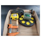 Several tape measures large cutter and clamp