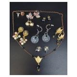 Mostly earrings with an earring and necklace set