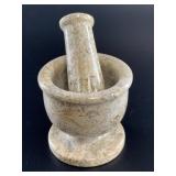 Decorative mortar and pestle made from fossil marb