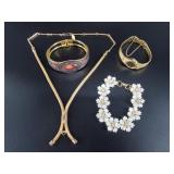Gold-toned fashion jewelry with several intricate