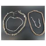 Several strands of multi-colored cultured pearls