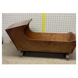 vintage wooden doll cradle. With music box