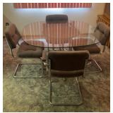 Glass top dining table and four chairs