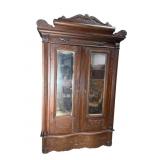 LARGE OAK CARVED JELLY ROLL WARDROBE