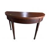 19TH CENT. MAHOGANY HALF ROUND FLIP TOP TABLE