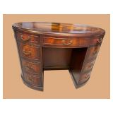 FLAMED MAHOGANY OVAL LEATHER TOP DESK