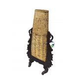 TAN AND BLACK BASKET ON STAND