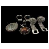 LOT OF SILVER TONED PENDANTS AND BAR BACK