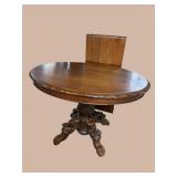 OAK HEAVY CARVED LION HEAD ROUND TABLE WITH LEAF