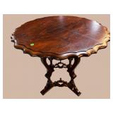 WALNUT CARVED BASE SCALLOPED EDGE CENTER TABLE