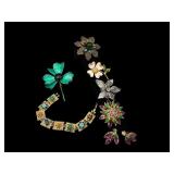 LOT OF FLORAL COSTUME BROOCHES AND GOLD TONED